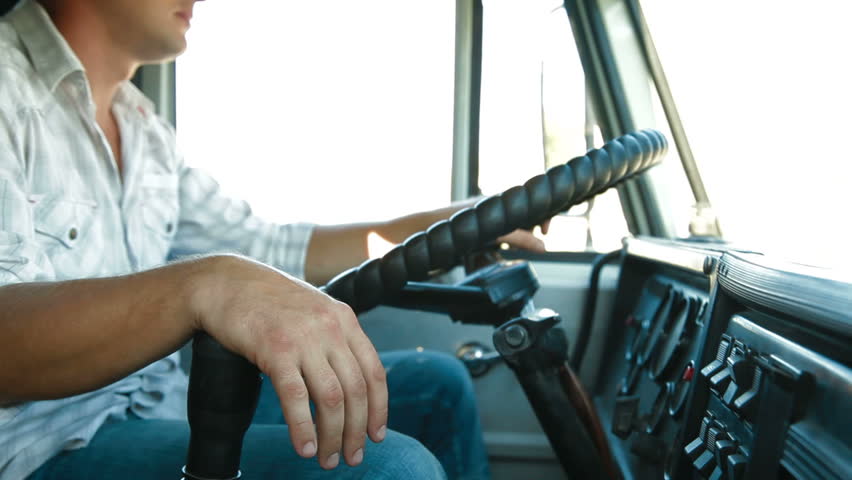Dump Truck Driver At The Wheel