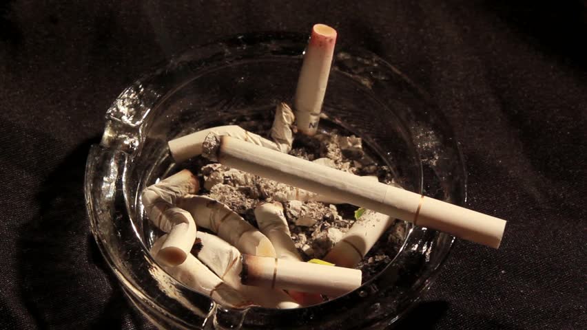 A burning cigarette in an ashtray -time lapse 5