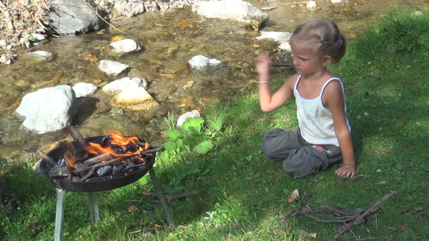 Child Throwing Firewood on the Grill, Little Girl at Picnic, Barbecue