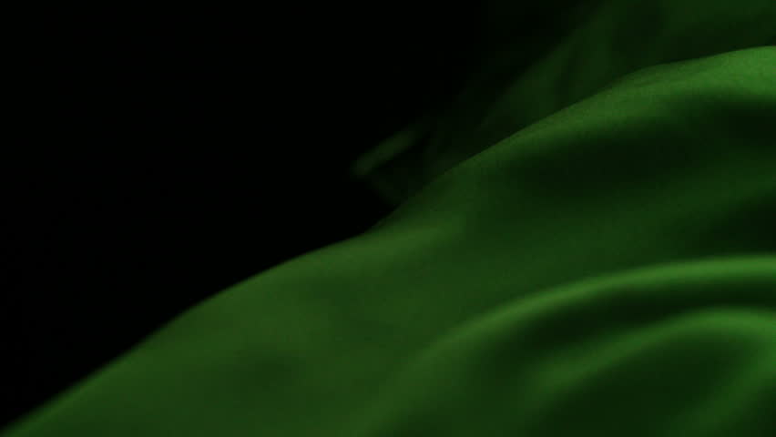 Green silk fabric blowing in the wind shooting with high speed camera.