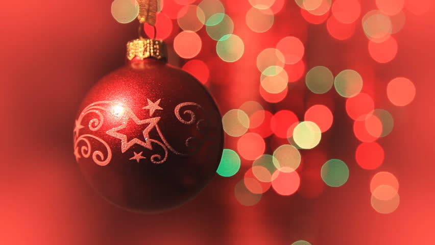 Christmas ball rotates at the background of blurred night lights