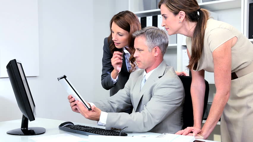 Business team colleagues pleased with results of current client presentation