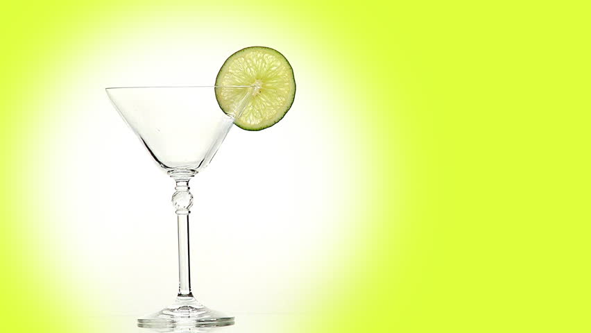 Martini with lime, olive, ice and straw
