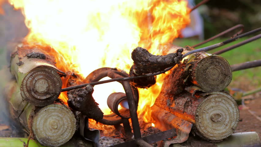 closeup burning dead body in Balinese funeral, Bali, Indonesia