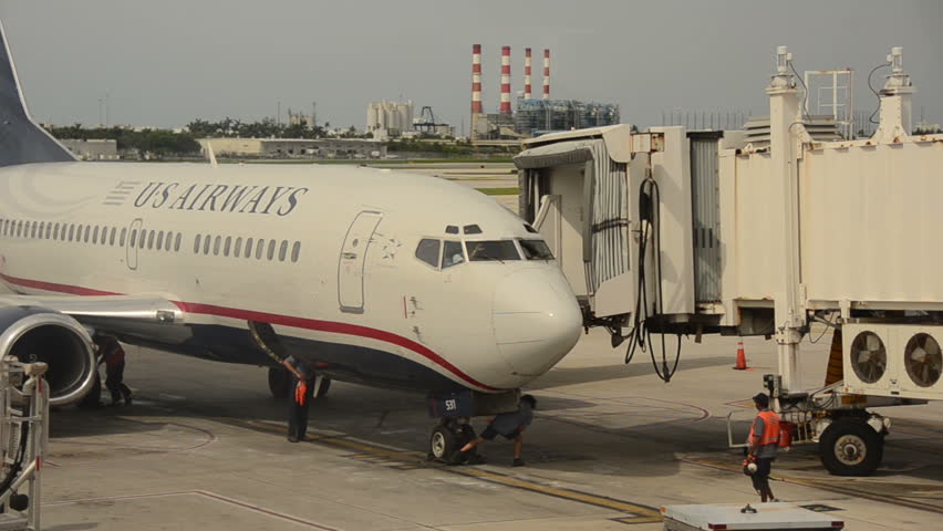 FORT LAUDERDALE - AUGUST 7: US Airways Boeing 737 passenger jet arrives at the terminal in Fort Lauderdale, Florida on August 7, 2012. US Airways uses Charlotte, NC as its hub