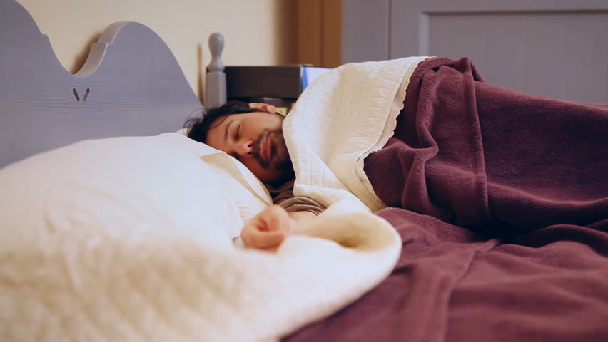 A sleeping man's reaction to something scary or annoying. See my other "
Ghost-themed clips for a complementary clip to add to this one. Suitable for horror, Halloween or Christmas scenes.