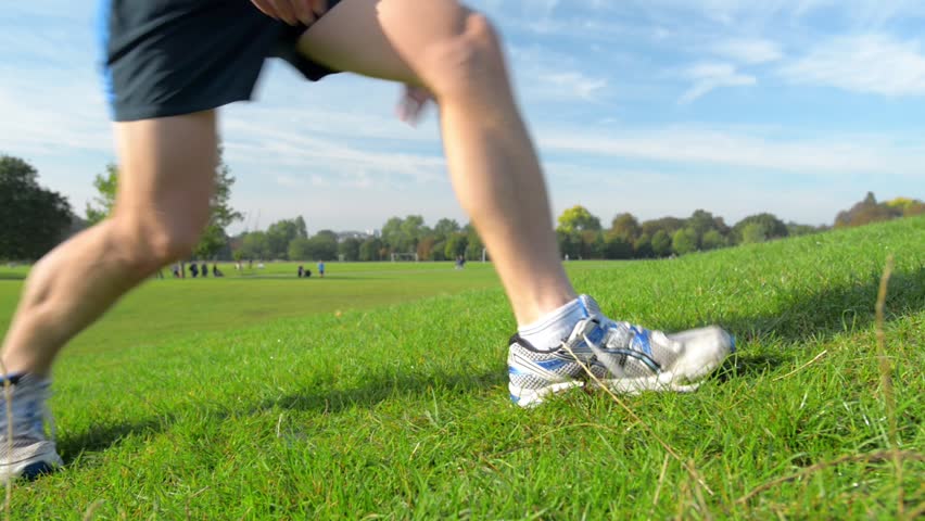 Close up of road runner tying shoelace high definition video