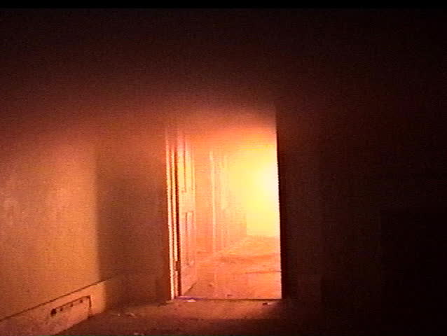 Firefighters move in to attack the fire.