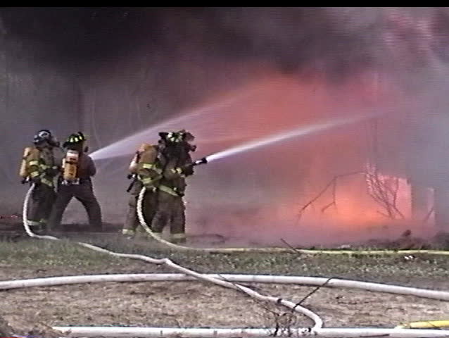 Firemen battle a house fire
