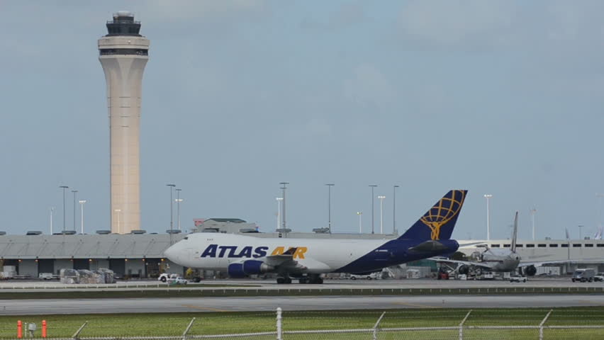 MIAMI - OCTOBER 12: Atlas Air jumbo jet arrives at the cargo terminal of Miami's airport on October 12, 2012. Atlas delivers cargo worldwide.