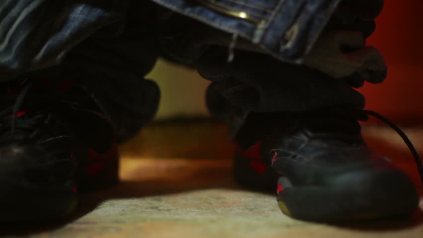 feet up close at the toilet.