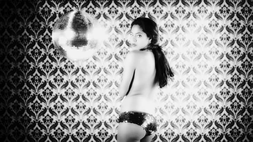 sensual shot of a beautiful woman dancing, covering her body with her hands