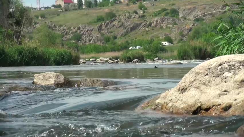 Water flowing over boulders