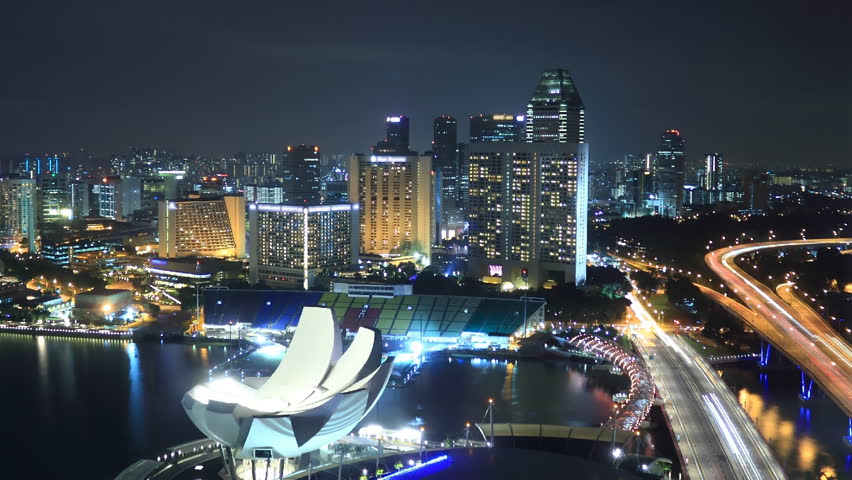 EL: Marina â Singapore January 10 2012: Time Lapse Singapore at Night. View to Marina in Singapore on January 10 2012