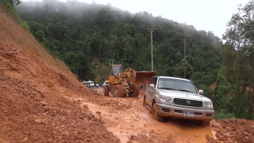 SOP HUN - AUGUST 14: Removal of land slide which caught a jeep by heavy machines August 14, 2012 in Sop Hun, Laos.
