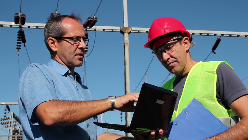 Engineers at High Voltage Substaion.Engineer gives instructions.HD1080p