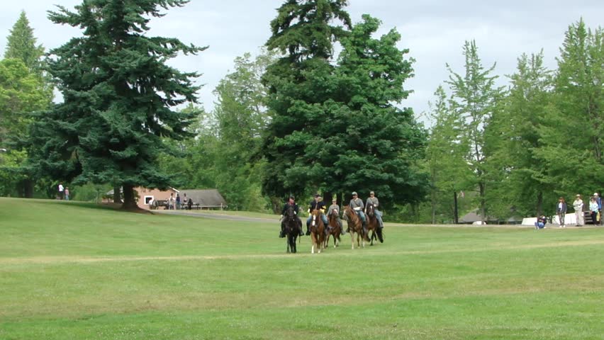PORT GAMBLE, WA - JUN 20 -  	Union and Confederate cavalry maneuver in open field		before a mock battle at Port Gamble WA on Jun 20, 2009.
