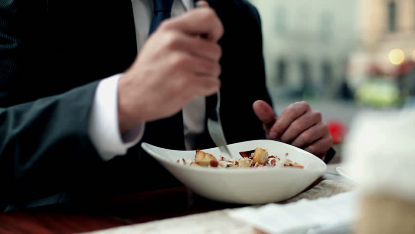 Business people eating dinner in the restaurant, outdoor
