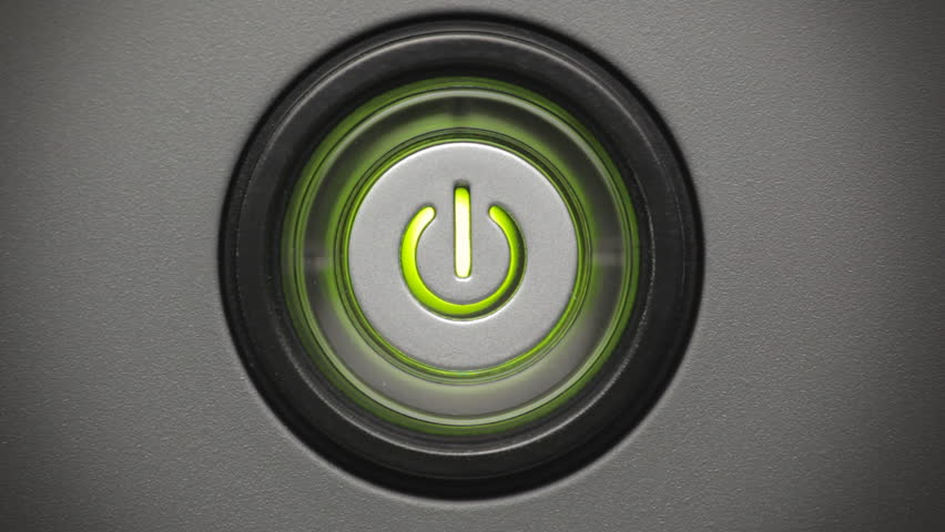 Press power button. Male index finger turning on a power button.
