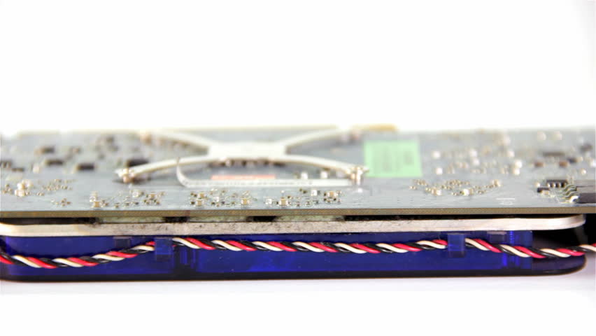 Computer Graphic hardware, older inputs for DVI and S-Video. One card with no cooling hardware. Cleaning dust with brush.