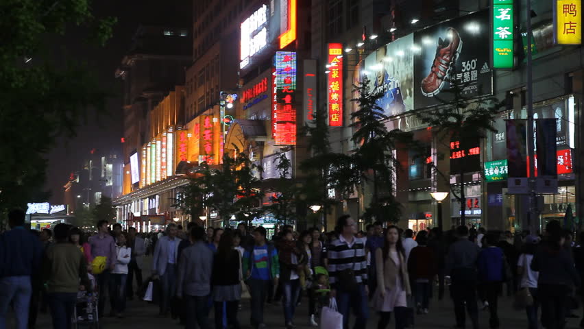 BEIJING, CHINA - APRIL 29, 2012 Shoppers on Famous Shopping Silver Street in Beijing, China, Neon Lights night