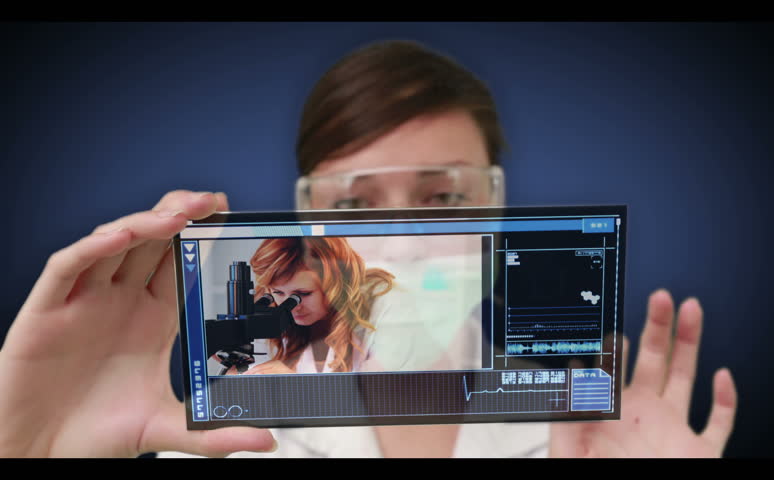 Scientist scrolling though medical resarch videos on interactive holographic menu and selecting one