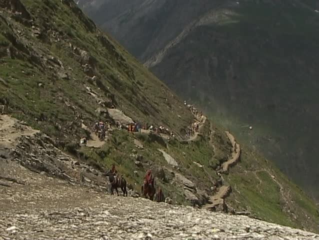 Helicopter flyes above groups of Hindu pilgrims