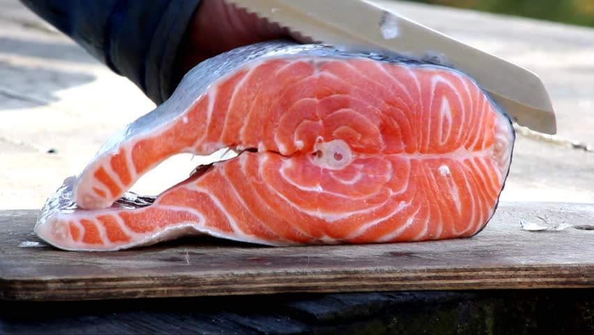 raw salmon fish piece on wooden tray,red fish,fish grill,red fish on charcoal,Red fish on the grill,grilled salmon,