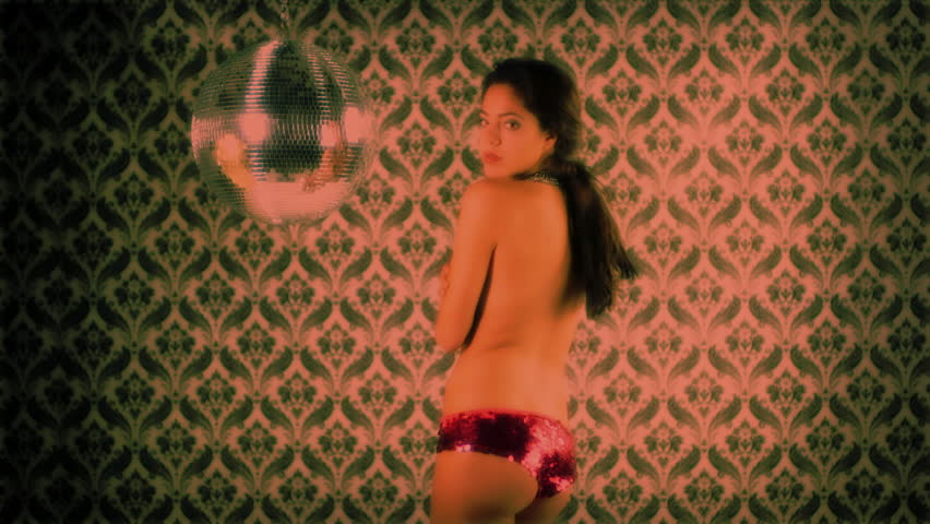 sensual shot of a beautiful woman dancing, covering her body with her hands