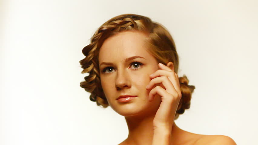 beautiful young blonde with creative braid hairdo
