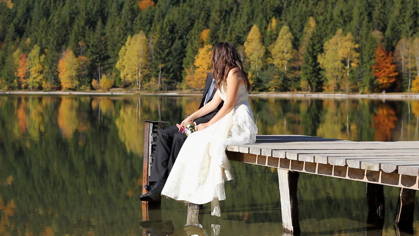 Young couple spending time together in a unique amazing wild place just after their wedding
