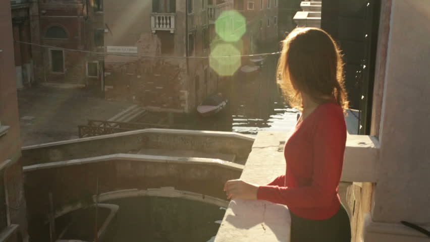 Young girl on a balcony in Venice