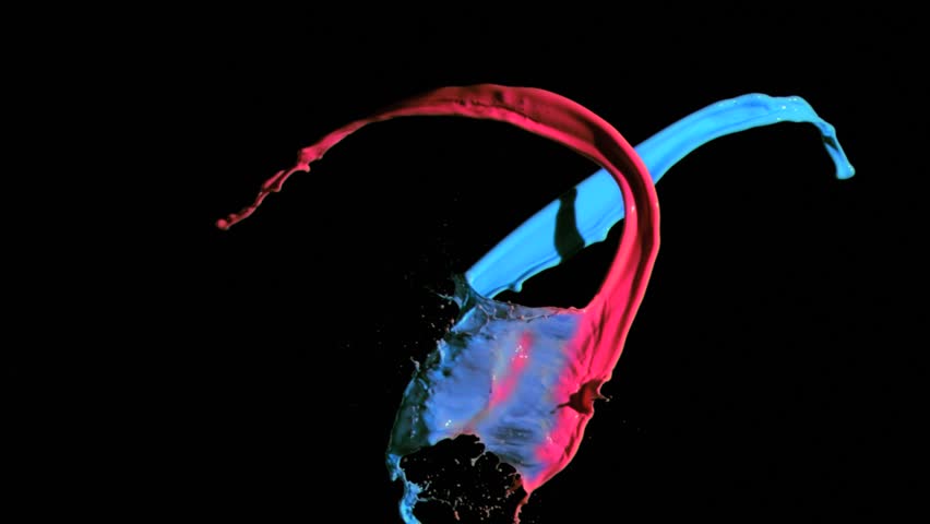 Blue and red paint in super slow motion splashing against a black background