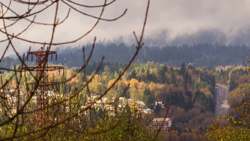 Time Lapse of landscape with highway and foggy mountains. Photo Sequence shot in RAW and Post-Production in After Effects.