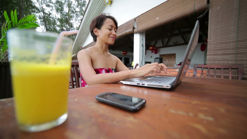 Freelance business woman working at cafe on a computer