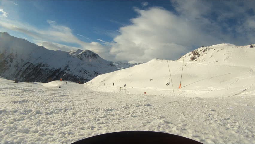 GoPro Winter sports,Snowboarding downhill with sunny conditions