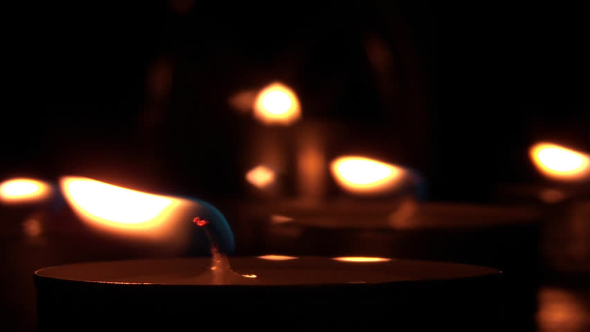Beautiful candle lights in pitch black night
