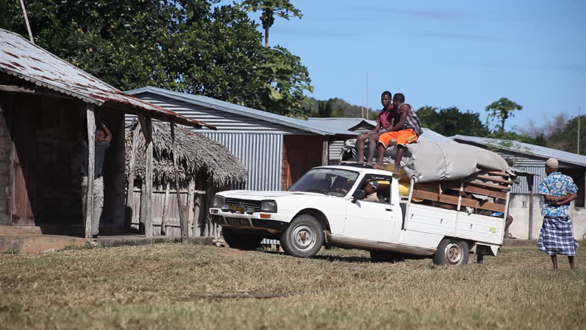 MADAGASCAR - JULY 2012. Malagasy villagers meet weekly transport truck. Funding shortfalls jeopardise World Food Programme's relief supplies deployed to cyclone-vulnerable areas in Madagascar.