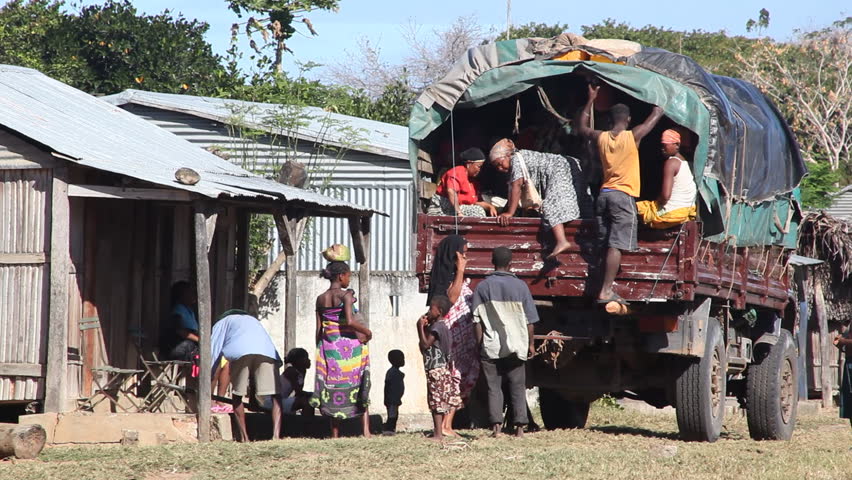 MADAGASCAR - JULY 2012. Malagasy villagers meet weekly transport truck. Funding shortfalls jeopardise World Food Programme's relief supplies deployed to cyclone-vulnerable areas in Madagascar.
