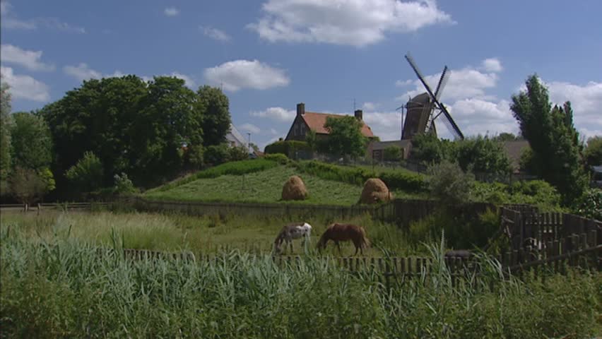 Windmill on man-made hill in Biervliet, Zeeland. Most of the province of Zeeland lies below sea level and was reclaimed from the sea by inhabitants over time.