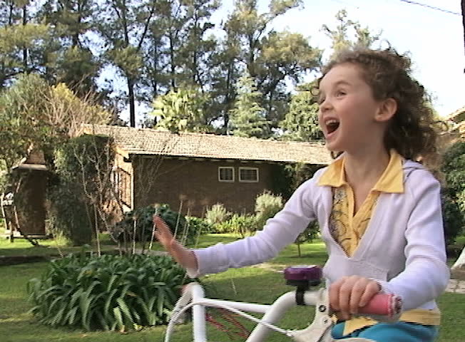 Girl riding a bicycle. Slow Motion
