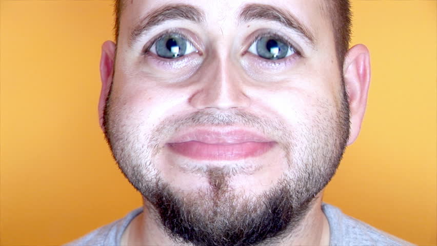 Man looking sad then a wide smile 
