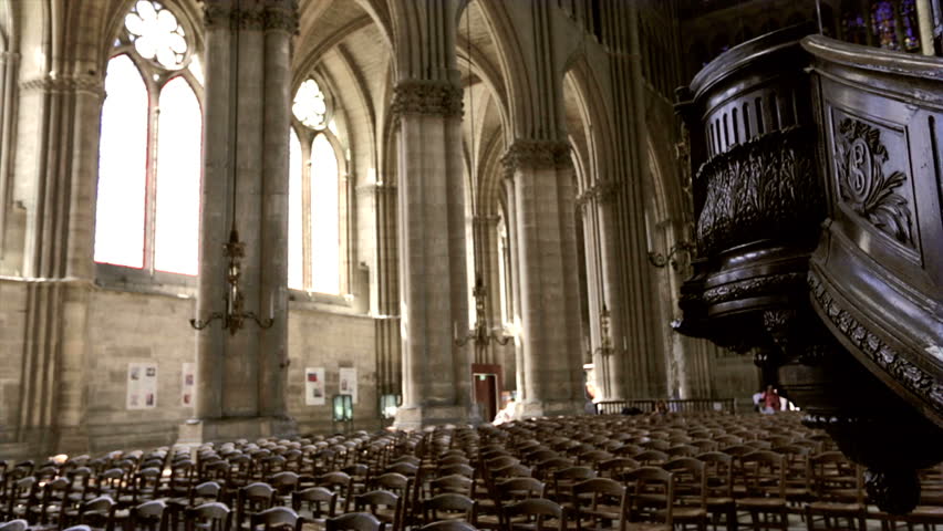REIMS, FRANCE - JULY 24, 2012: Tourists and believers in the wonderful Roman Catholic church where the kings of France were once crowned