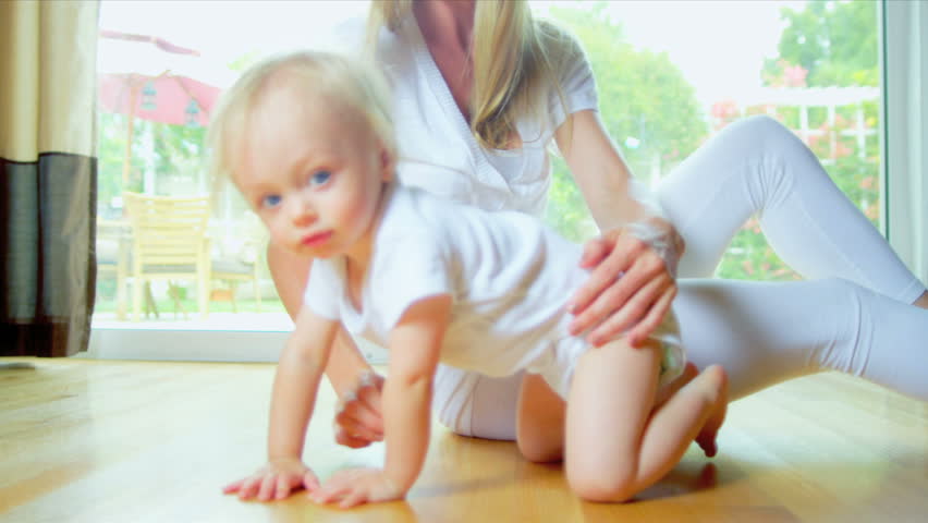 Close Up Smiling Baby Crawling Home