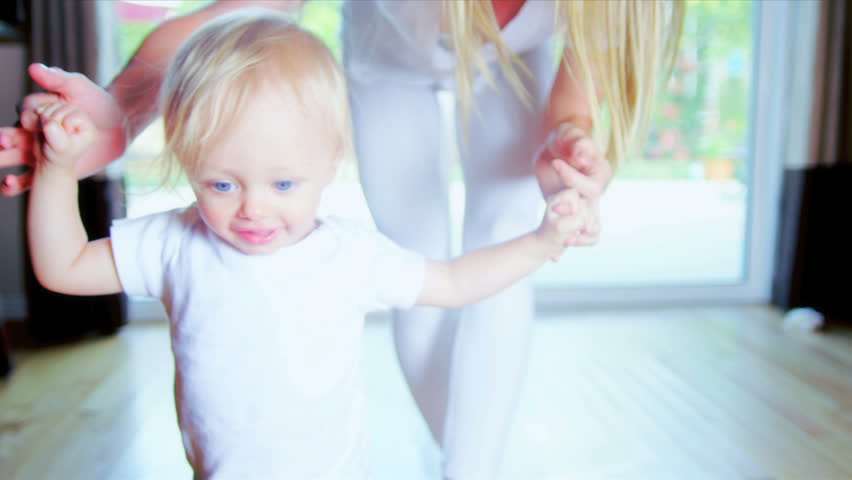 Young Child Taking First Steps