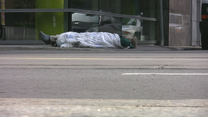TORONTO, CANADA â JANUARY 11: Homeless man on the sidewalk in downtown Toronto, January 11, 2009. The federal estimate of the number of homeless people in Canada was 150,000 in 2005.