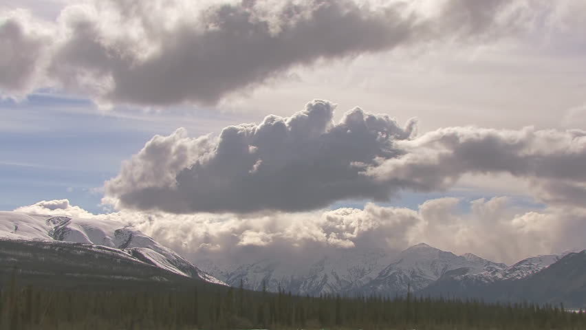 Vigorous and intense roiling cloudlapse over the mountains surrounding Kluane Lake in Yukon Territory, Canada.