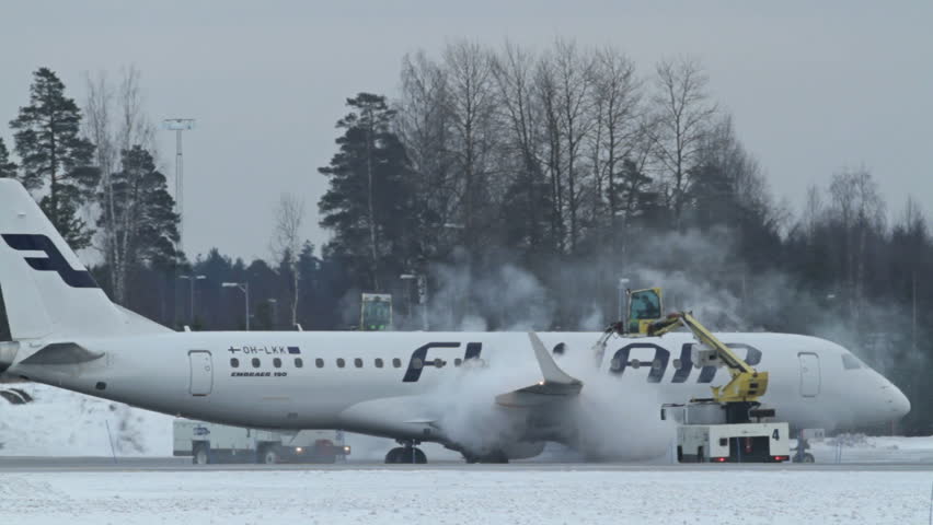 OSLO, NORWAY - DEC 6: Winter, cold weather at OSL Airport, Oslo Norway. Airplane doing deice before takeoff on December 6, 2012.