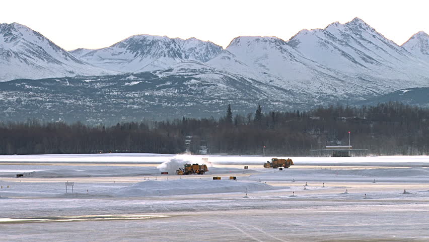 Snow Blowers and Grader Working to Keep Runway Clear