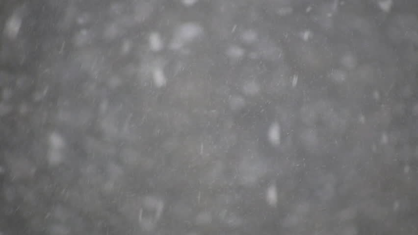 Snowflakes shoot across the screen in this blizzard scenic (High Definition)